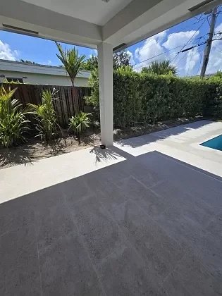 Grouted porcelain paver pool deck in Jupiter